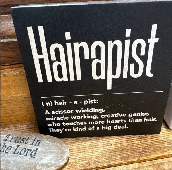 Hand-lettered Hairapist sign in the salon