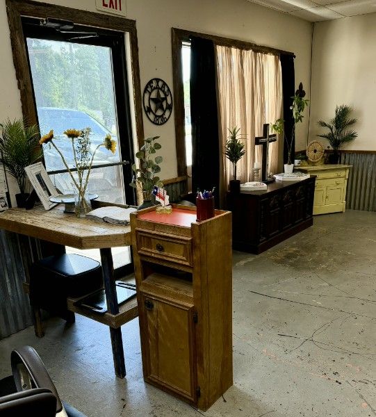 Styling station with barn-wood mirror and corrugated-metal wall