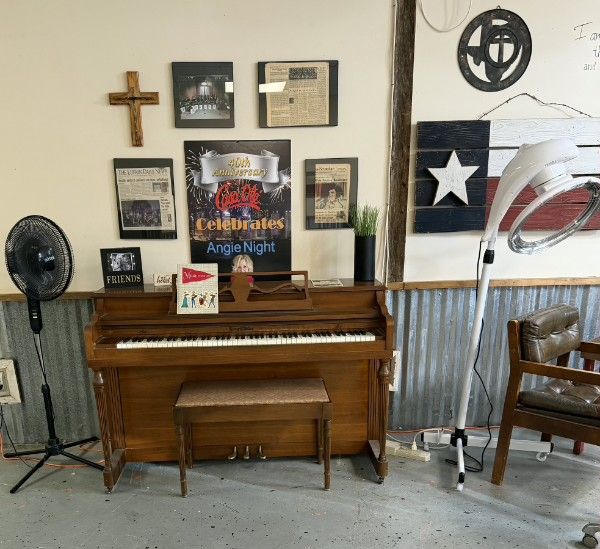 Vintage piano and rustic decor inside the salon